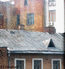 Окна квартиры Ю. Грибковой. Вид из дома 4 по Плотникову переулку.